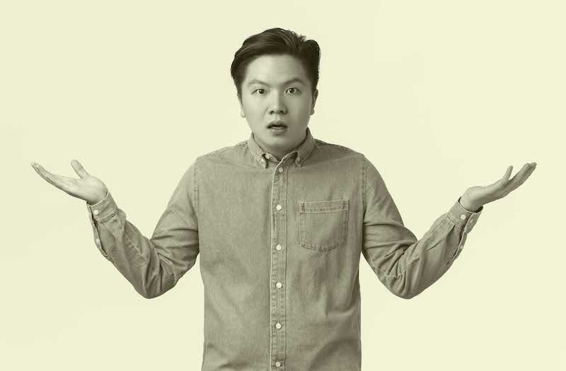 Confused and puzzled asian man in shirt cant understand what happening, raising hands sideways and shrugging, waiting explanation, being wondered, standing questioned white background