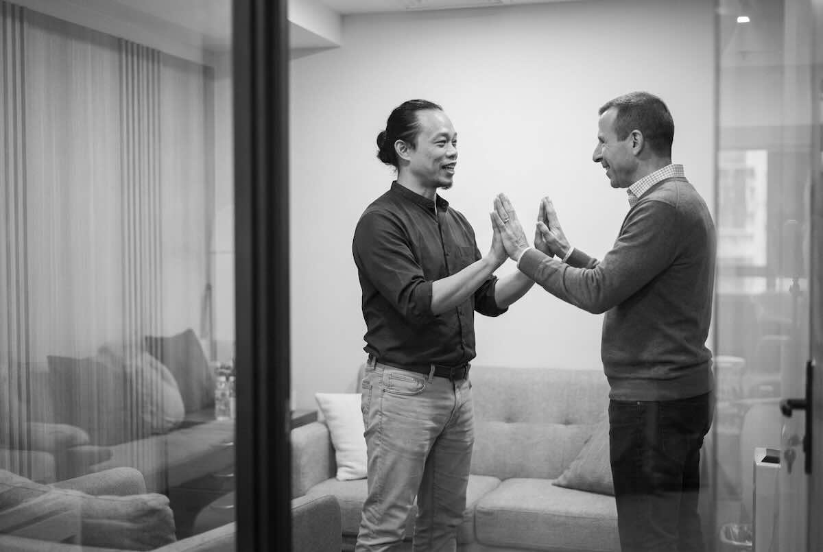 Executive Communication Coach Ellery Ng working guiding his client through a somatic experiment to uncover his interpersonal barriers