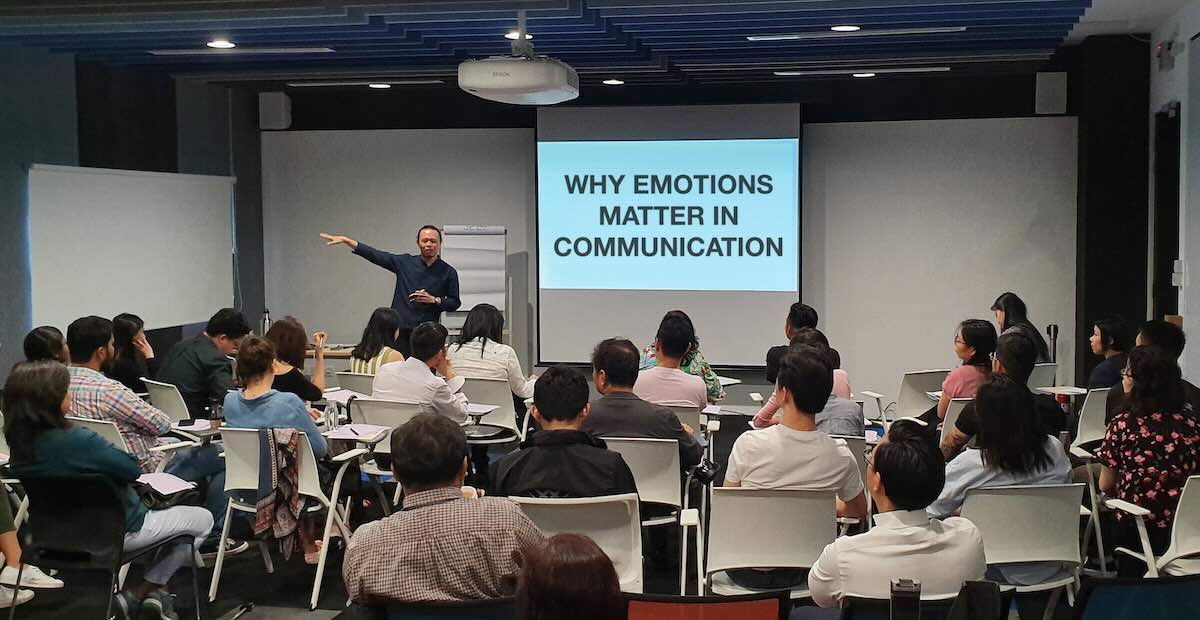 Audience attending a communication workshop seminar focused on improving public speaking and presentation skills